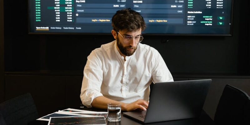 focused professional man using laptop